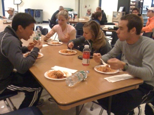 John, Lauren, Sara, and Kevin enjoying spaghetti dished up by girl scouts in Laconia around 2am.